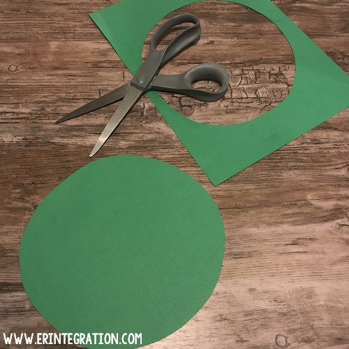 piece of green paper cut into a circle for green screen